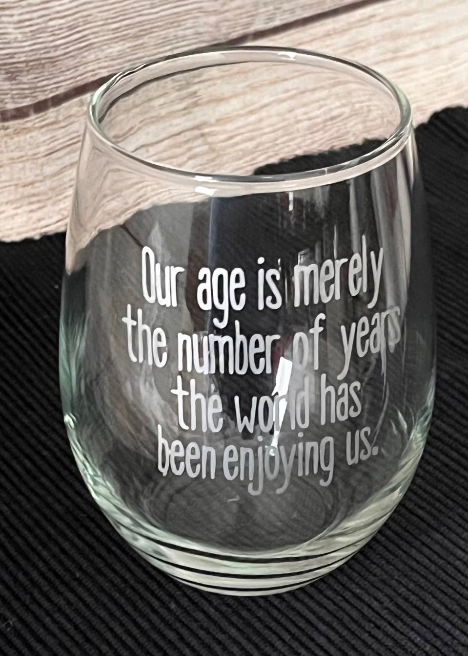 "World has been enjoying us" Wine Glass